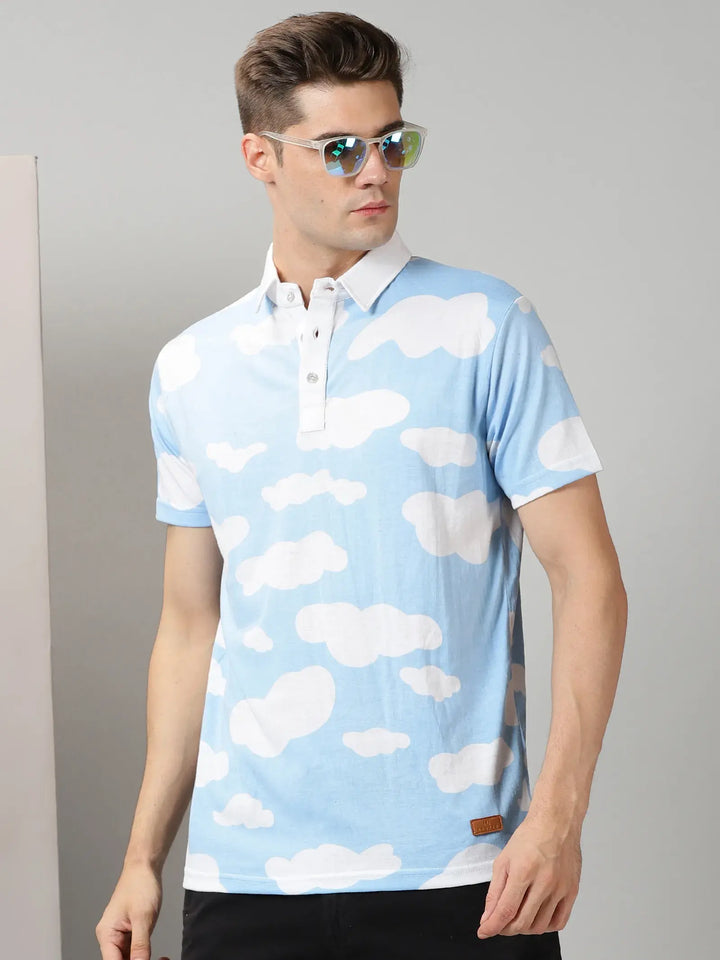 Blue With White Clouds Design Polo T-Shirt By Rodzen