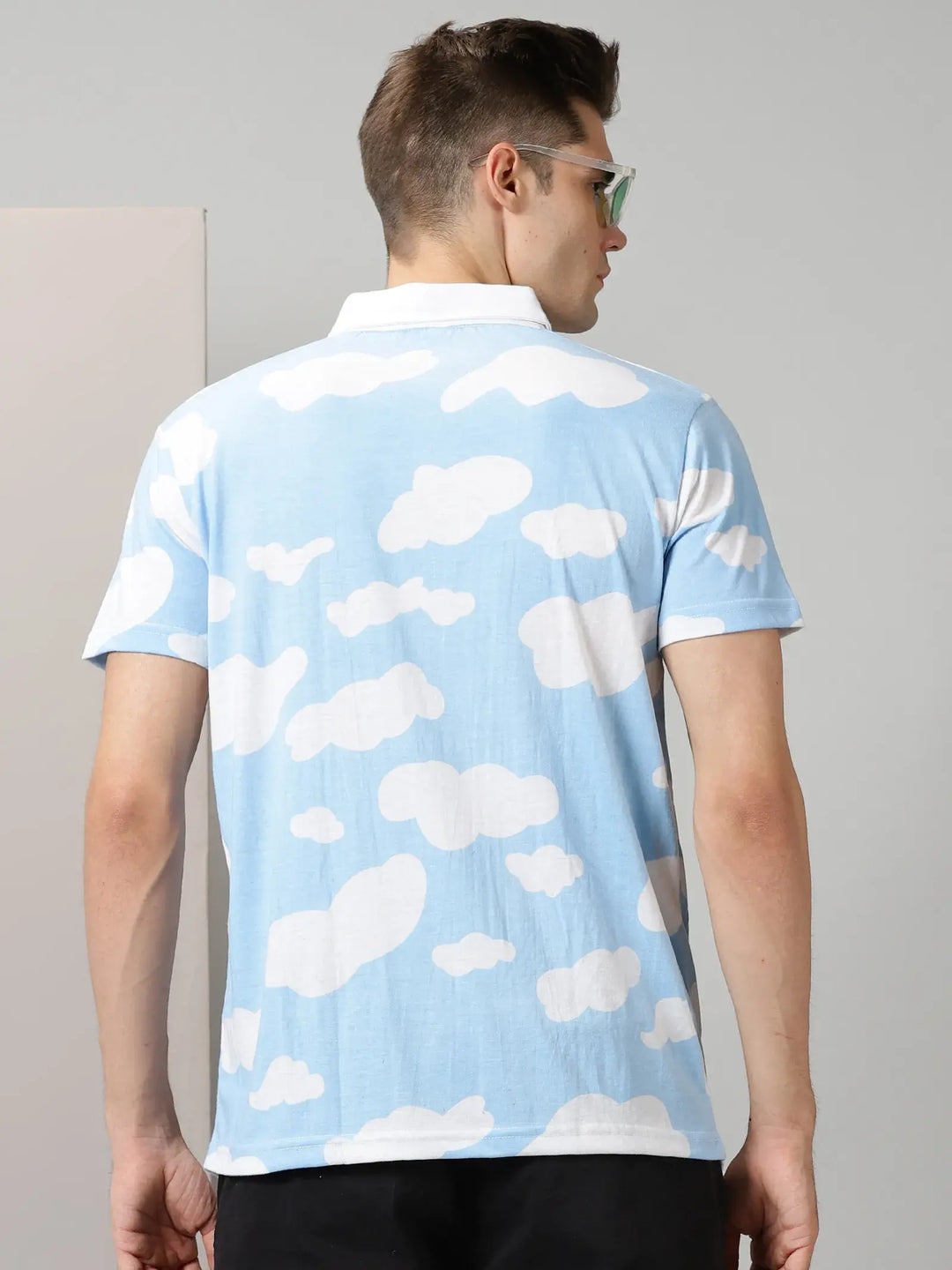 Blue With White Clouds Design Polo T-Shirt By Rodzen