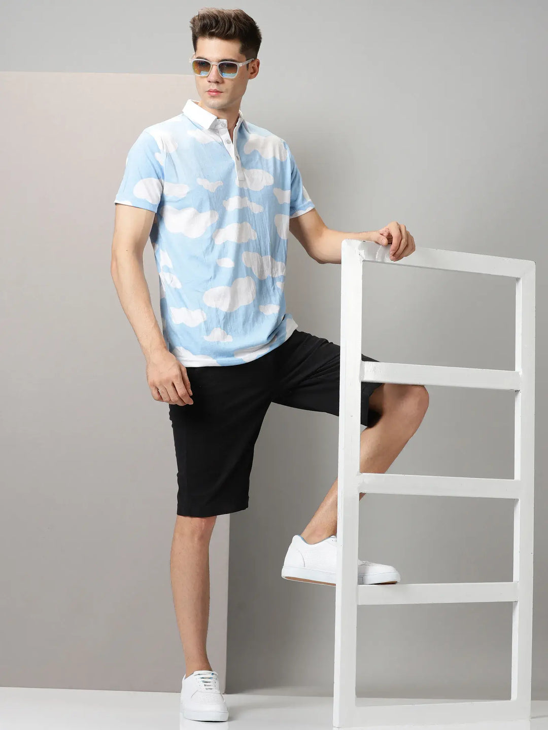 Blue With White Clouds Design Polo T-Shirt By Rodzen