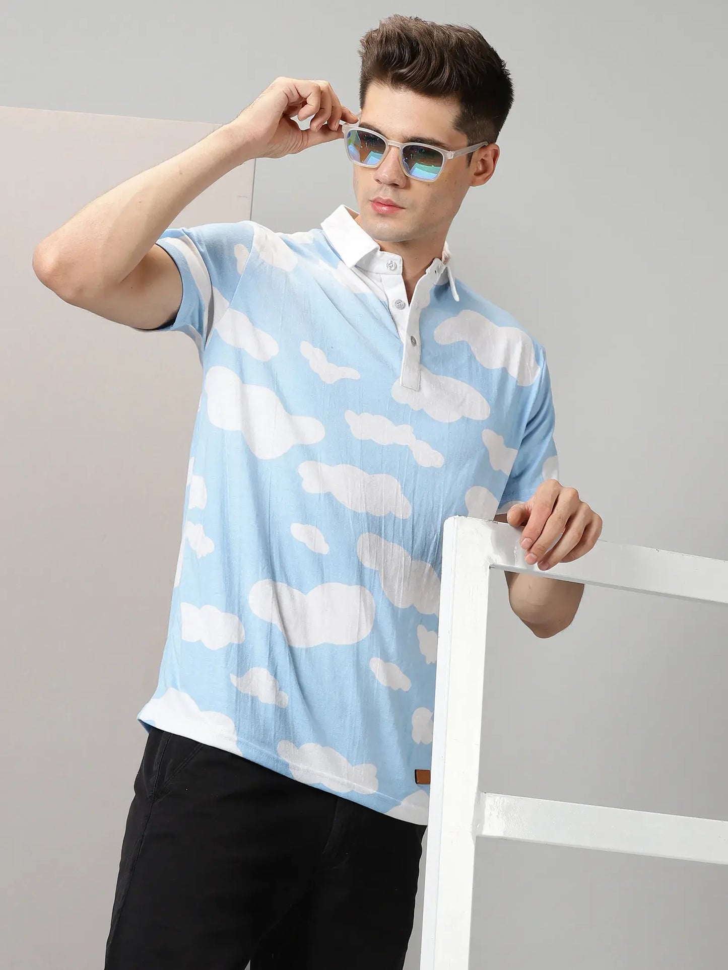 Blue With White Clouds Design Polo T-Shirt By Rodzen