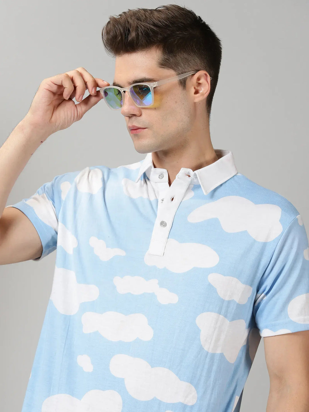 Blue With White Clouds Design Polo T-Shirt By Rodzen